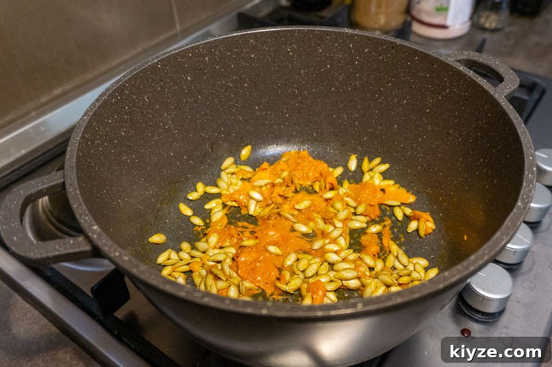 Creamy Pumpkin Soup from Scratch — No Stock or Blender Needed 3 Toasting the reserved pumpkin seeds & flesh