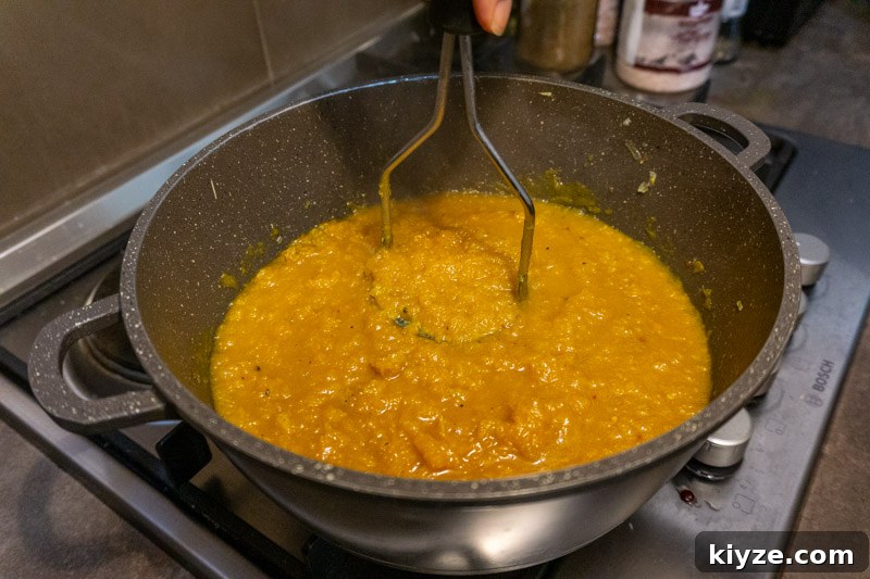 Creamy Pumpkin Soup from Scratch — No Stock or Blender Needed 7 Breaking up the pumpkin - essential if you don't have a blender!