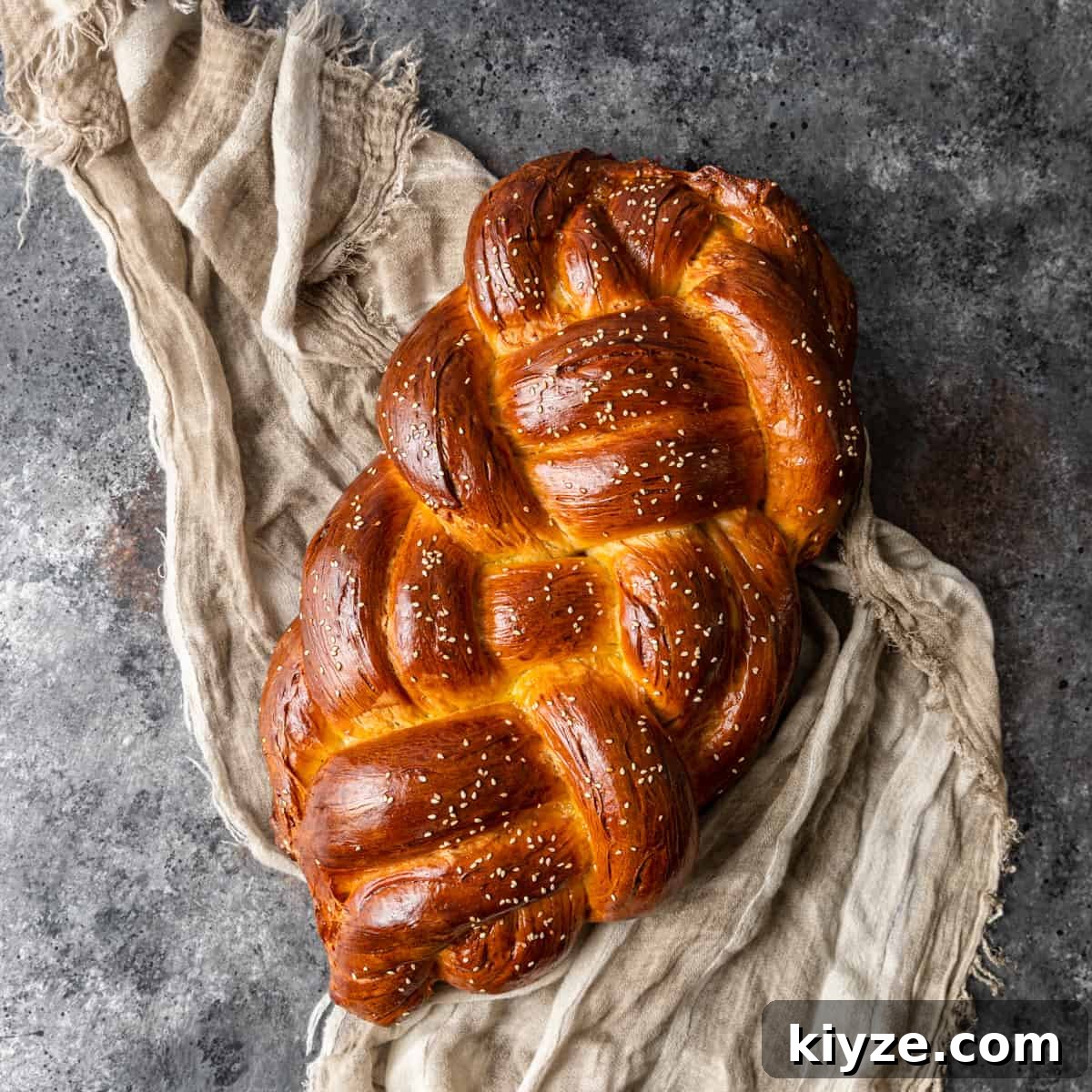 Classic Fluffy Challah Recipe for Braiding and Baking 2 overhead: challah bread set on tea towl on table