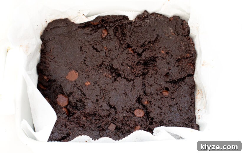 Decadent Chocolate Frosted Brownies Recipe 8 unbaked brownies in white casserole dish