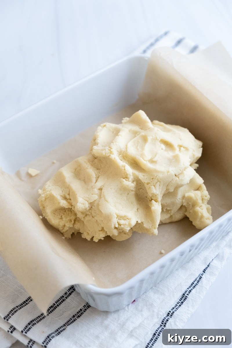 Traditional Scottish Shortbread Cookies Recipe — Buttery & Crisp 15 dough in lined pan