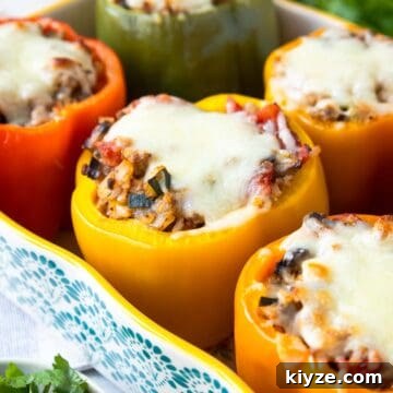 Ground Turkey and Rice Stuffed Bell Peppers Recipe 15 Baking dish with six whole stuffed bell peppers topped with melted mozzarella cheese.