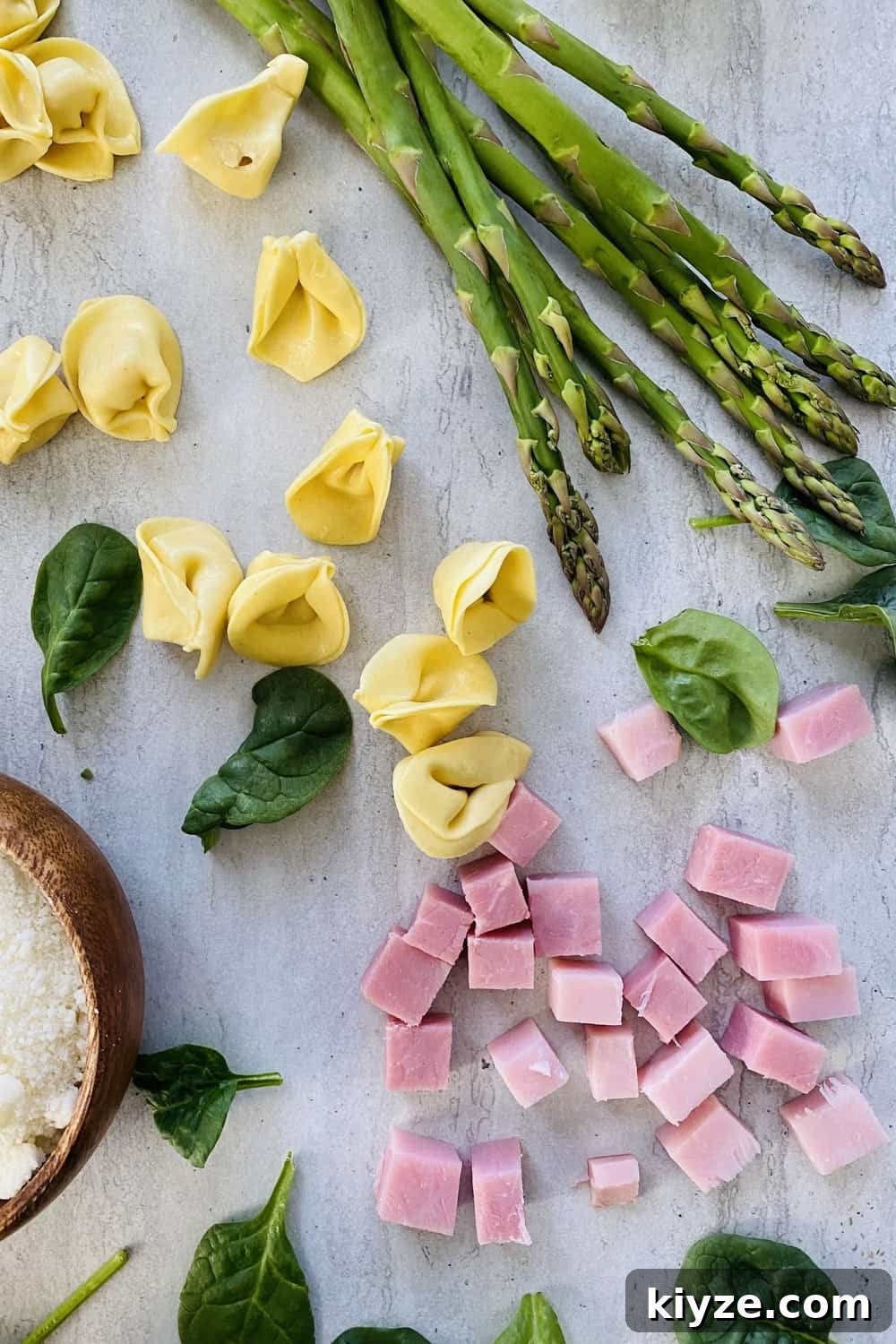 diced ham, asparagus, baby spinach, tortellini pasta, Parmesan cheese