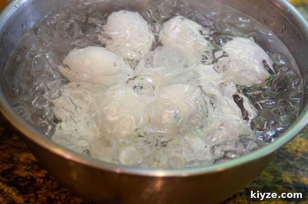 How to Make Hard-Boiled Eggs That Peel Perfectly 5 Hard boiled eggs in a bowl of ice water.