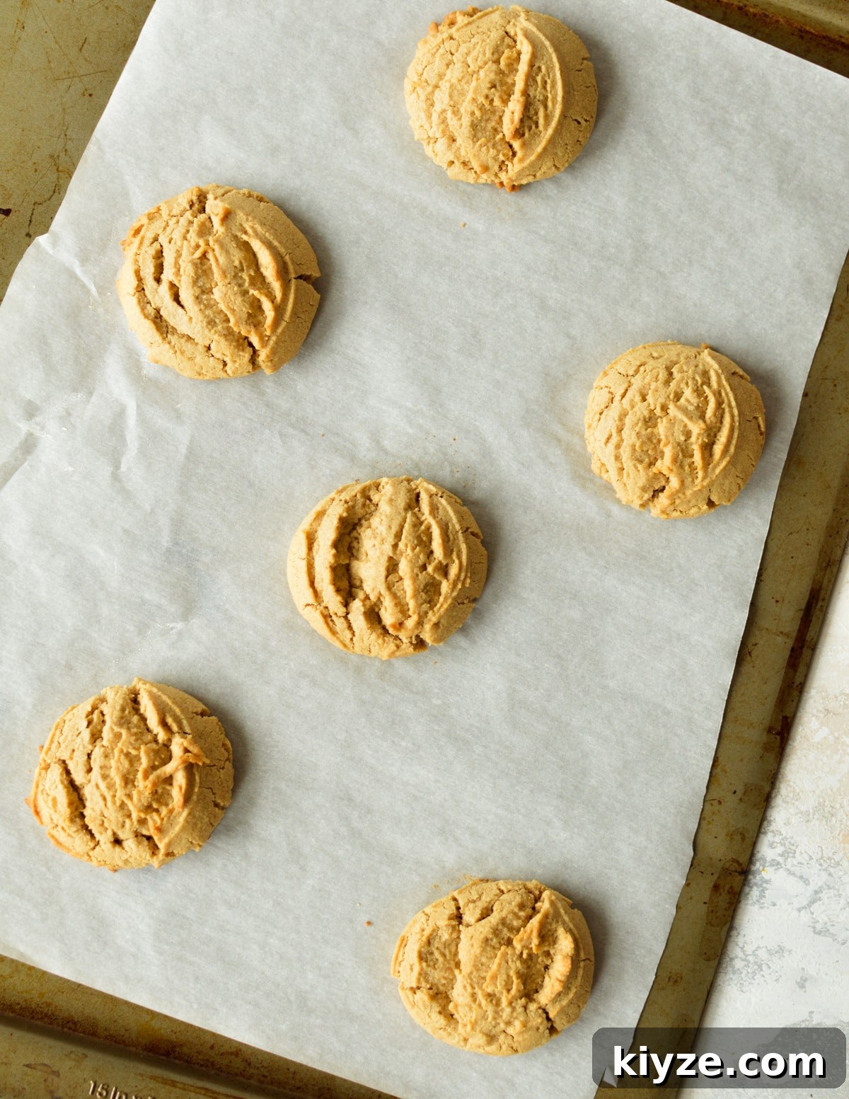 Chewy Peanut Butter Cookies Made with Oat Flour 11 peanut butter cookies on sheet pan.