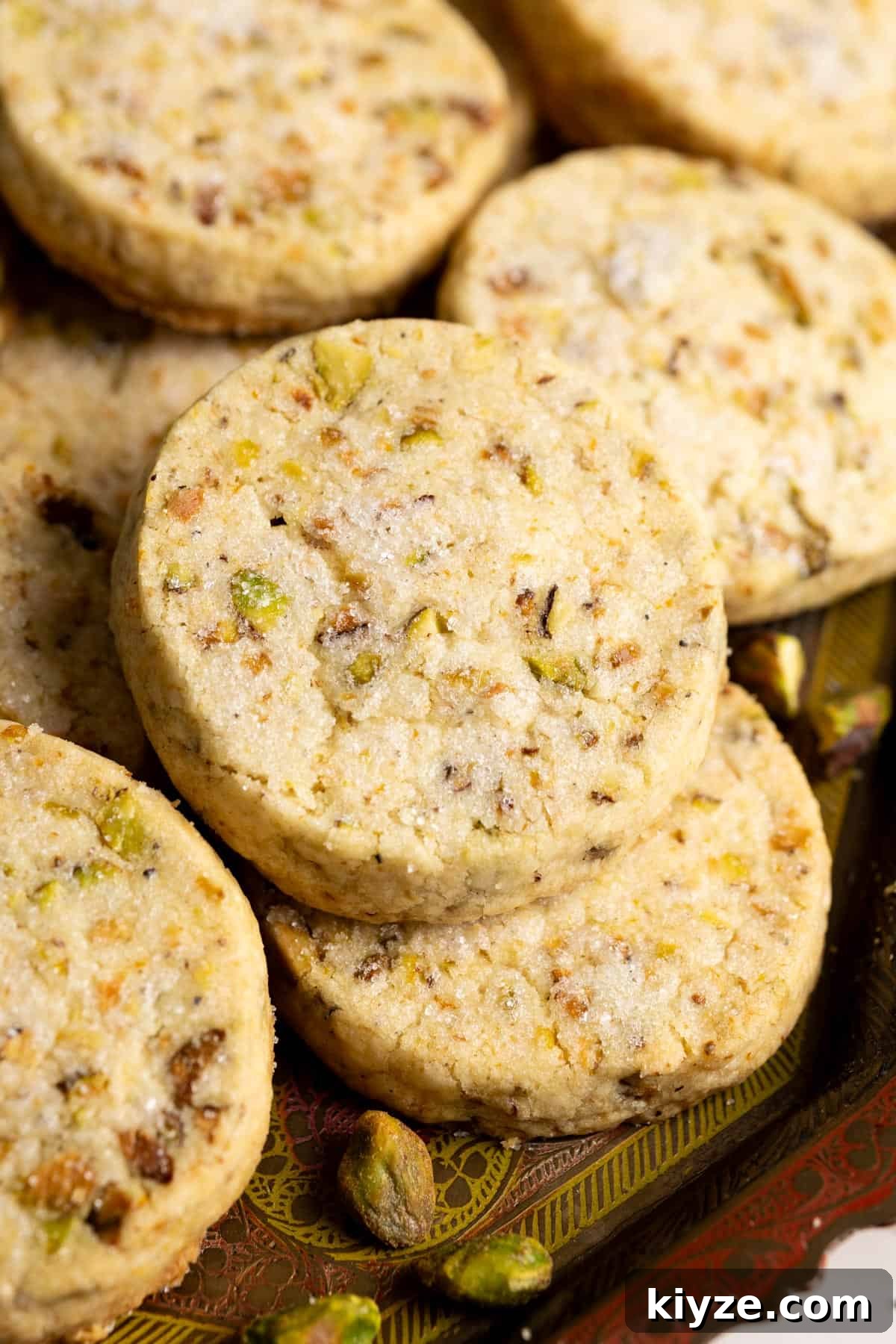 Pistachio shortbread cookies on a tray.