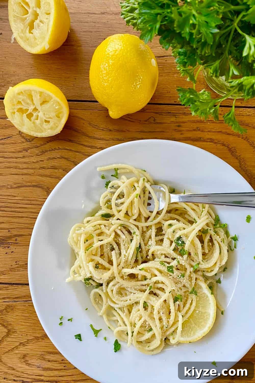 Parmesan Garlic Butter Noodles Recipe 2 bowl of buttered noodles with Parmesan, lemons and parsley