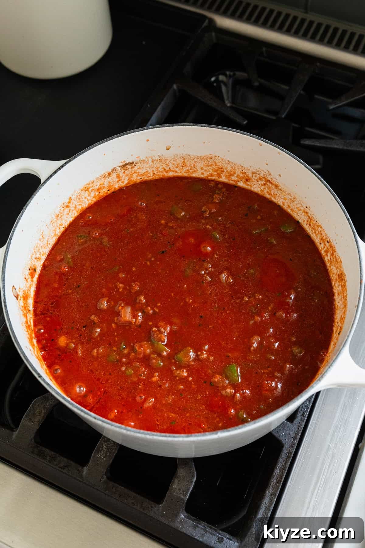 Classic American Chop Suey with Ground Beef Recipe 6 All liquid ingredient added to a cooking pot.