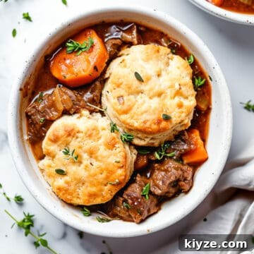 Aldi Weekly Meal Plan for £25 – Week 4 Shopping & Recipes 4 Beef cobbler with cheddar biscuits- slow cooker beef in a bowl.