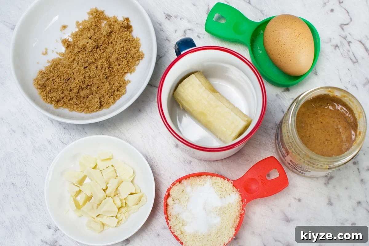 Gluten-Free Banana Mug Cake Recipe — Quick Single-Serve Dessert 3 Ingredients to make a gluten free mug cake with banana, almond and white chocolate: brown sugar, 1/2 a banana, white chocolate, almond flour and baking soda, almond butter and an egg