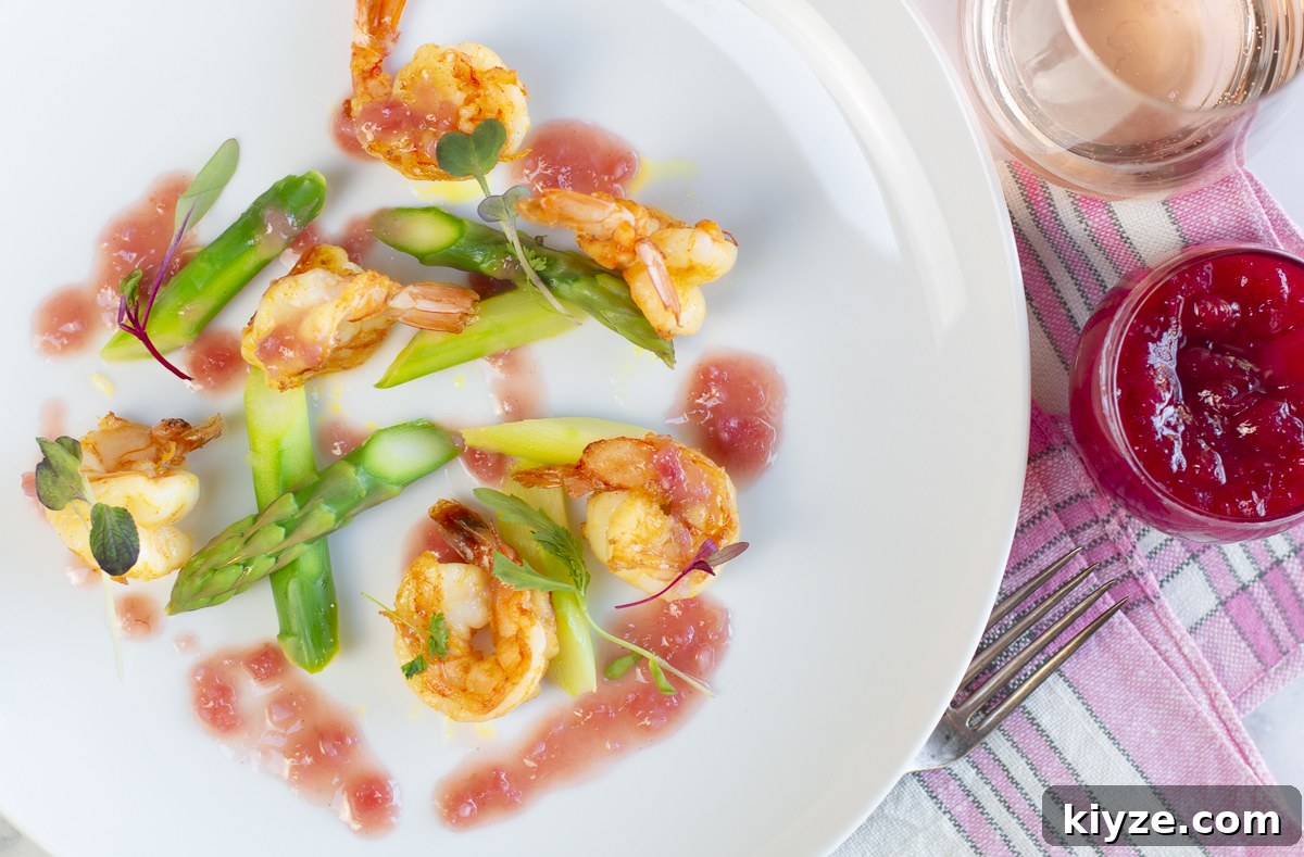 13 Rhubarb Recipes + New Gluten-Free Rhubarb Scones with Glaze 12 Shrimp with Rhubarb Vanilla Bean Butter Sauce with asparagus in a white plate