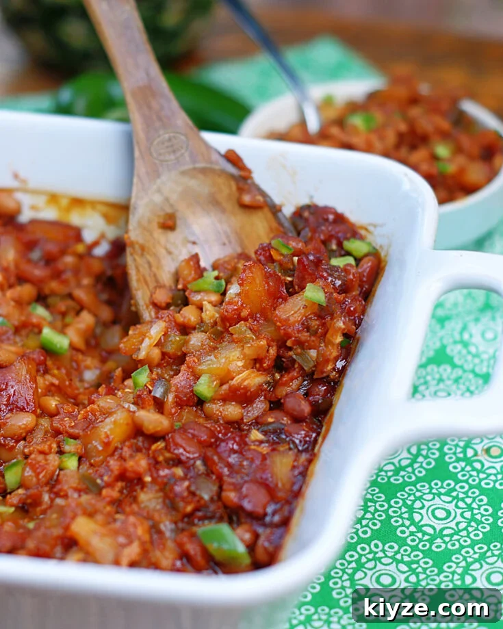 A spoonful of Hawaiian Baked Beans fresh from the oven.