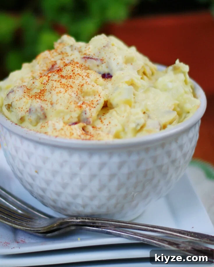 Deviled egg potato salad texture, ingredients and garnish of papriks