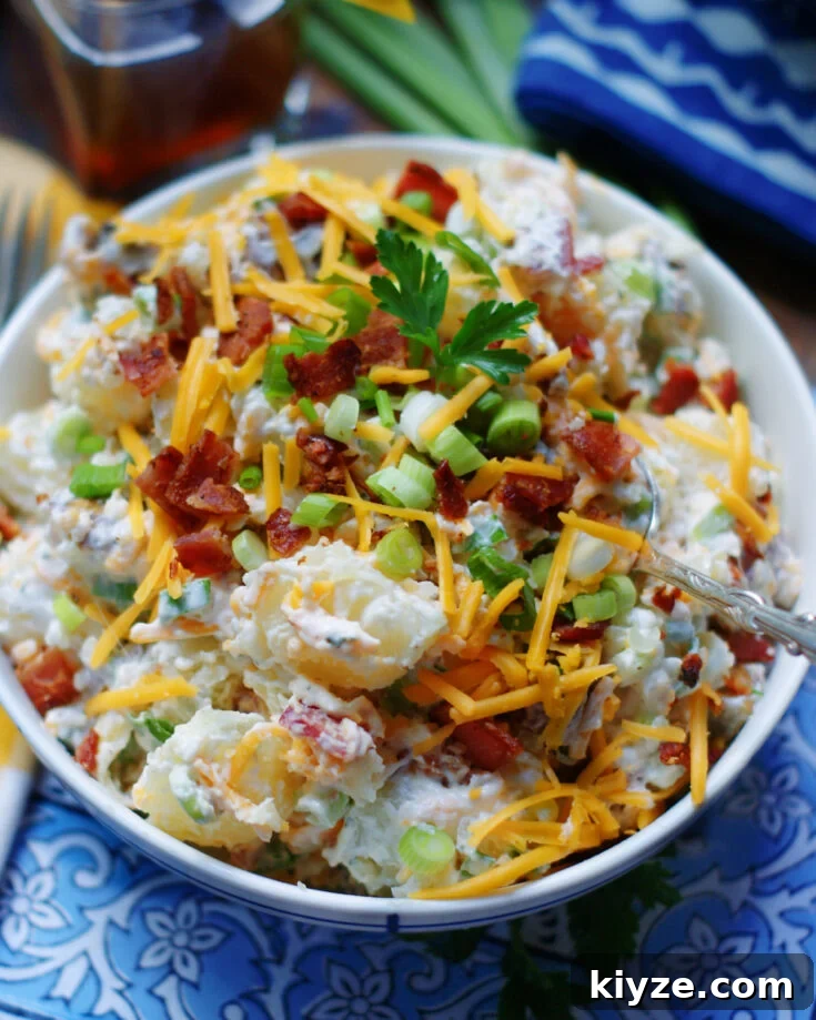 A bowl of potato salad inspired by a loaded baked potato.