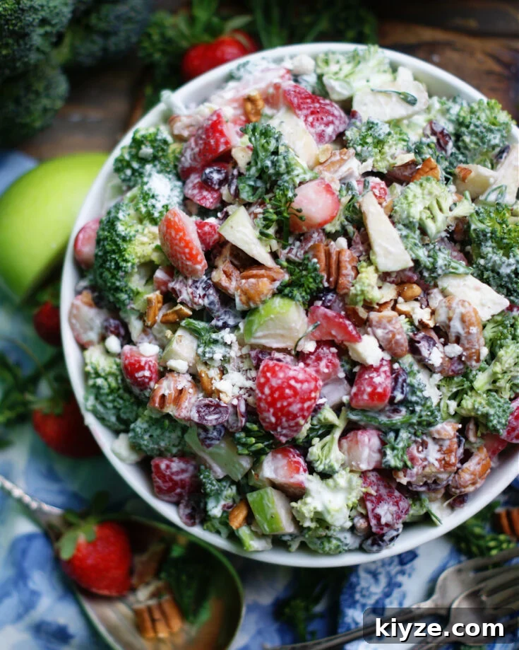 An overhead look at a classic potluck or cookout salad with crunchy broccoli and a tangy, creamy homemade dressing.