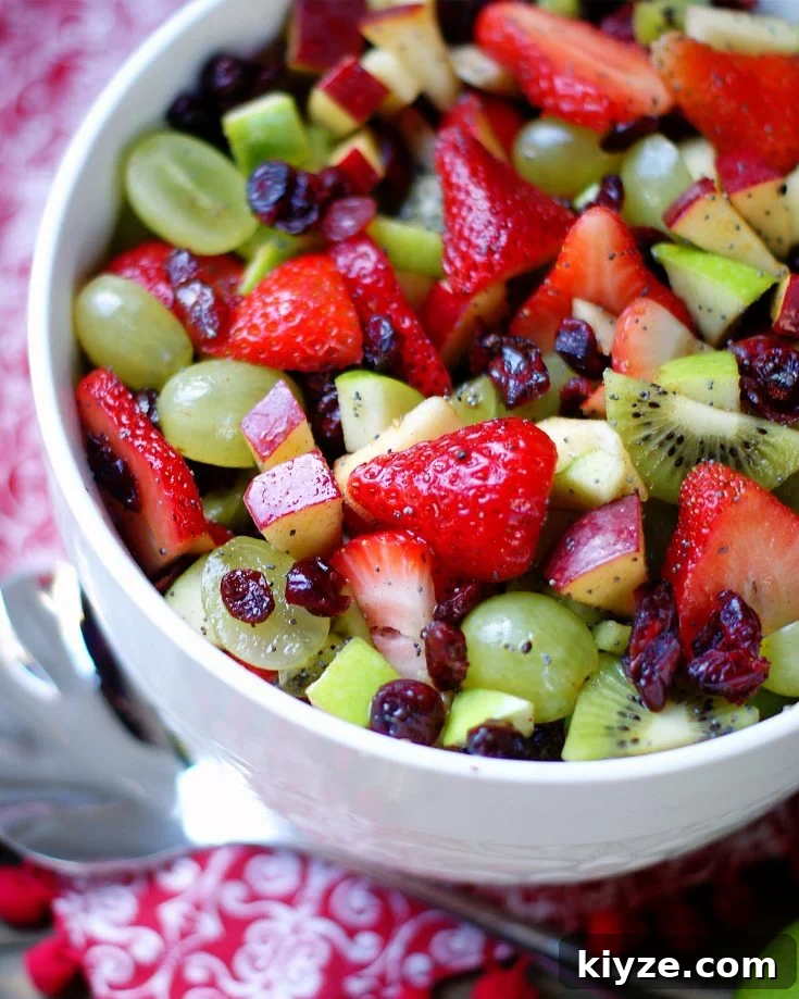 Red & green Fruit salad in a white bowl