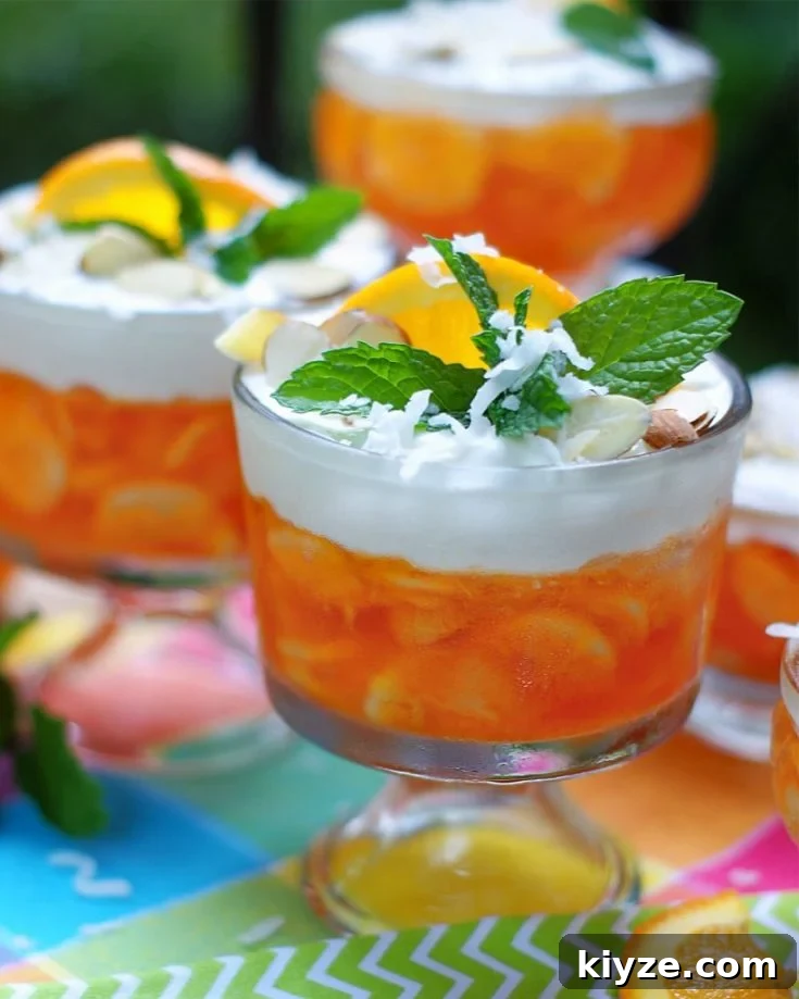 An individual dessert bowl of orange jello salad