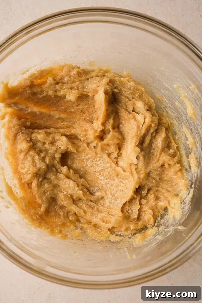 a clear mixing bowl filled with honey butter mixture