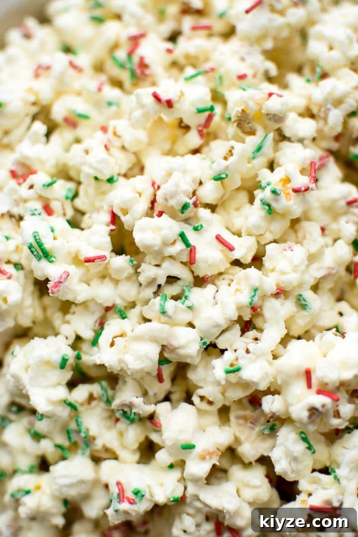 Festive Christmas Popcorn Recipe for Holiday Parties 4 close-up of red and green sprinkles on Christmas popcorn