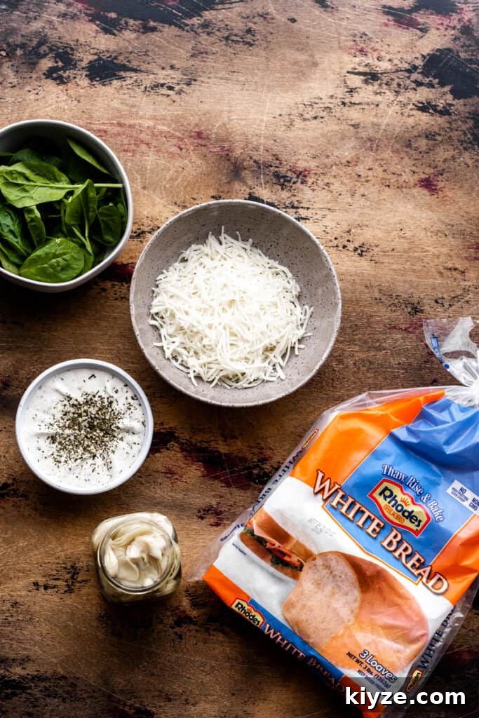 Deep-Dish Spinach and Artichoke Pizza Recipe 4 Bowls of cheese, spinach, artichoke hearts, and the Rhodes dough on a wooden surface.