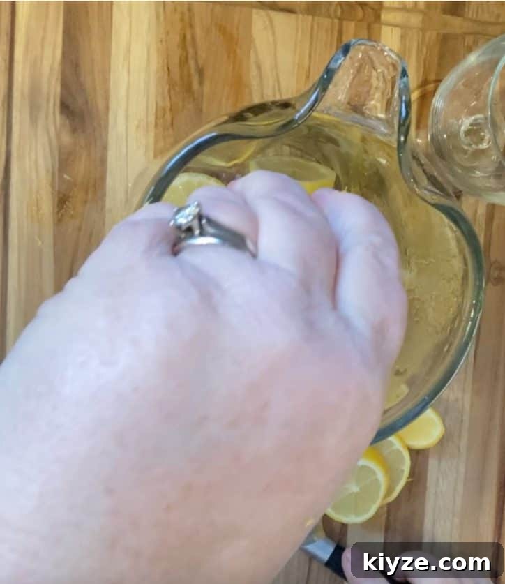 Benefits of Drinking Lemon Water Daily 7 squeezing lemons