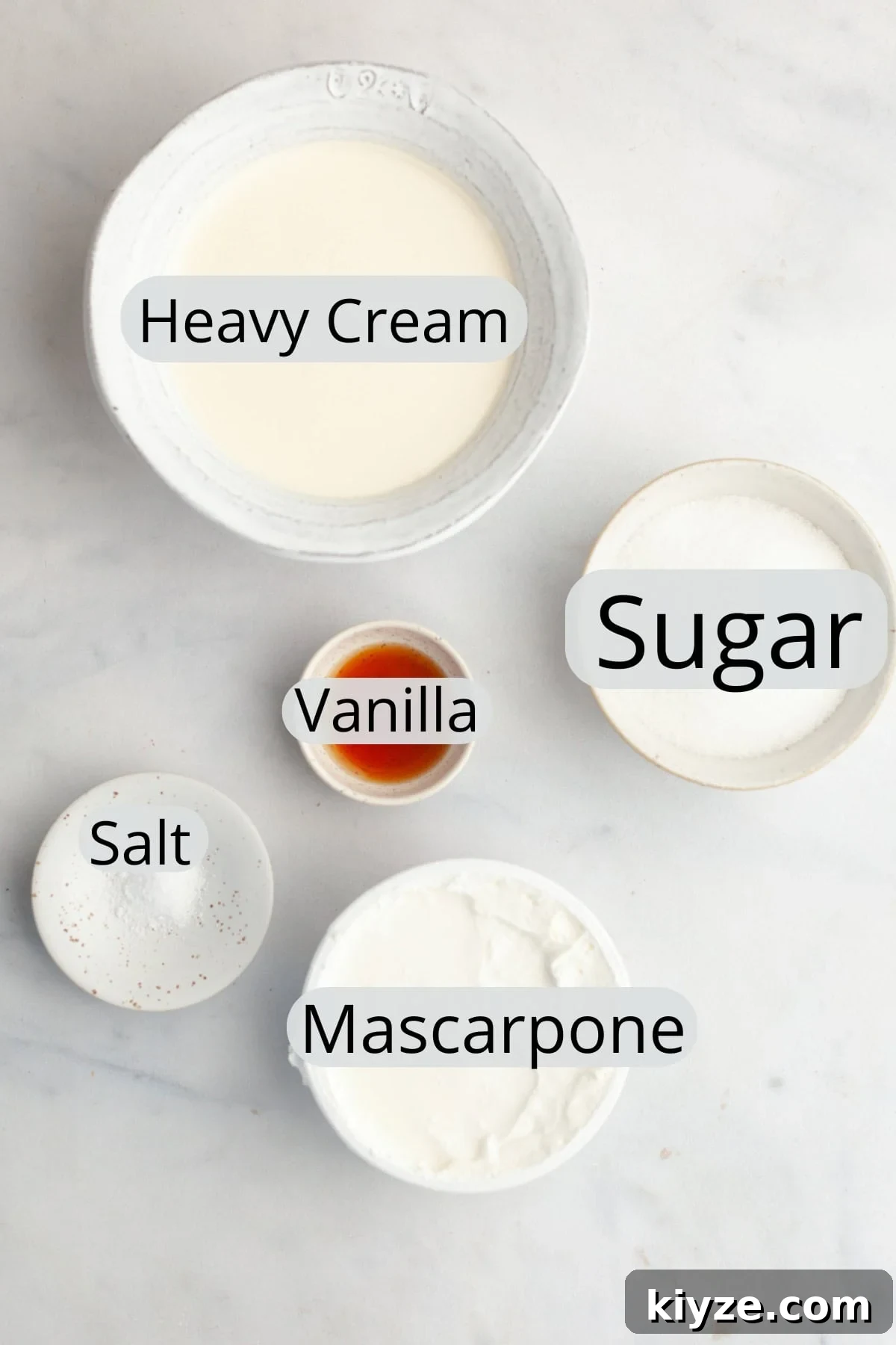 Mascarpone Whipped Cream Frosting Recipe — 5 Ingredients 3 All the ingredients needed to make mascarpone whipped cream frosting, weighed out into small bowls.