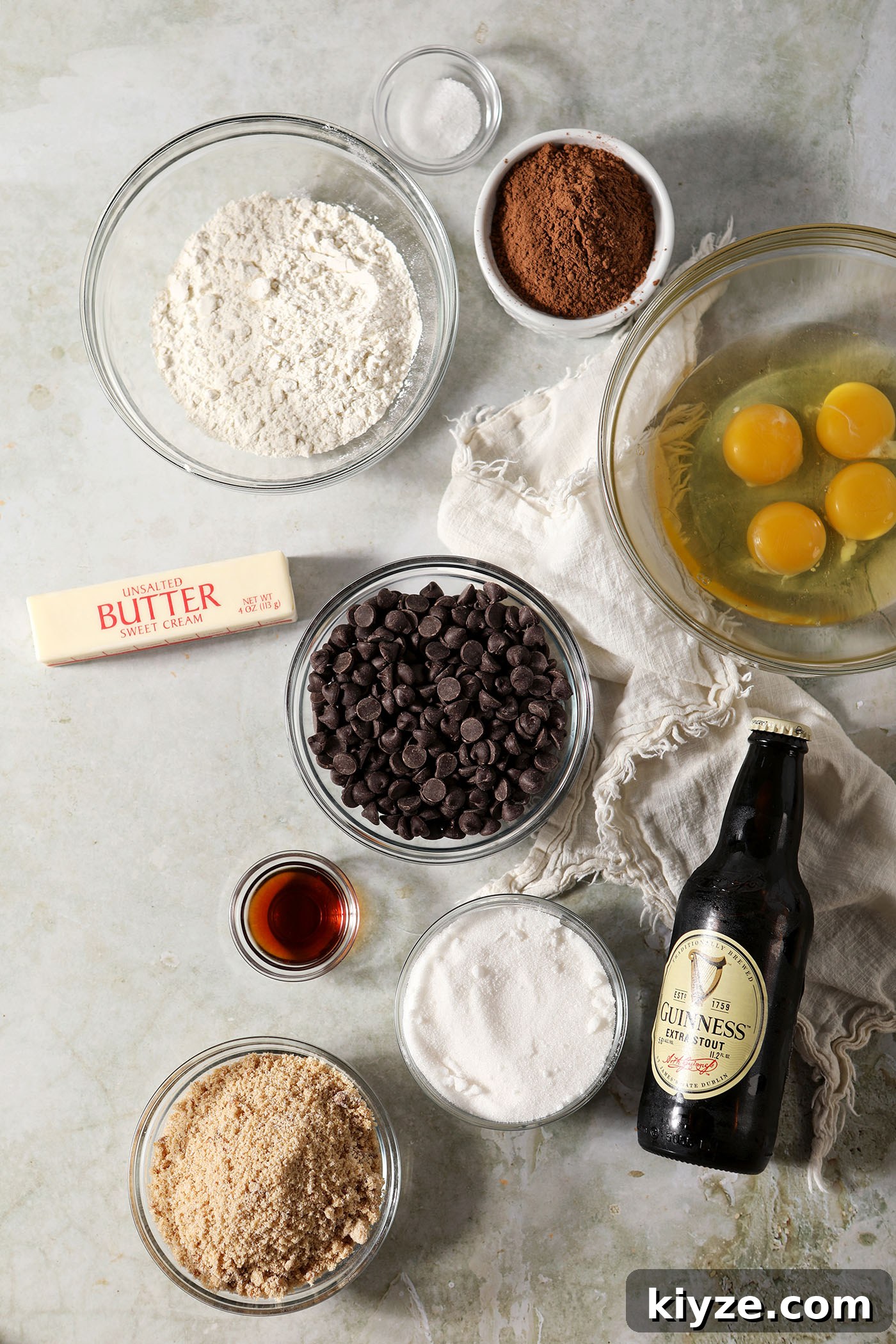 Decadent Guinness Chocolate Brownies: Rich Stout-Infused Recipe 3 Ingredients to make Guinness stout brownies in bowls on a light green surface with a cream-colored linen