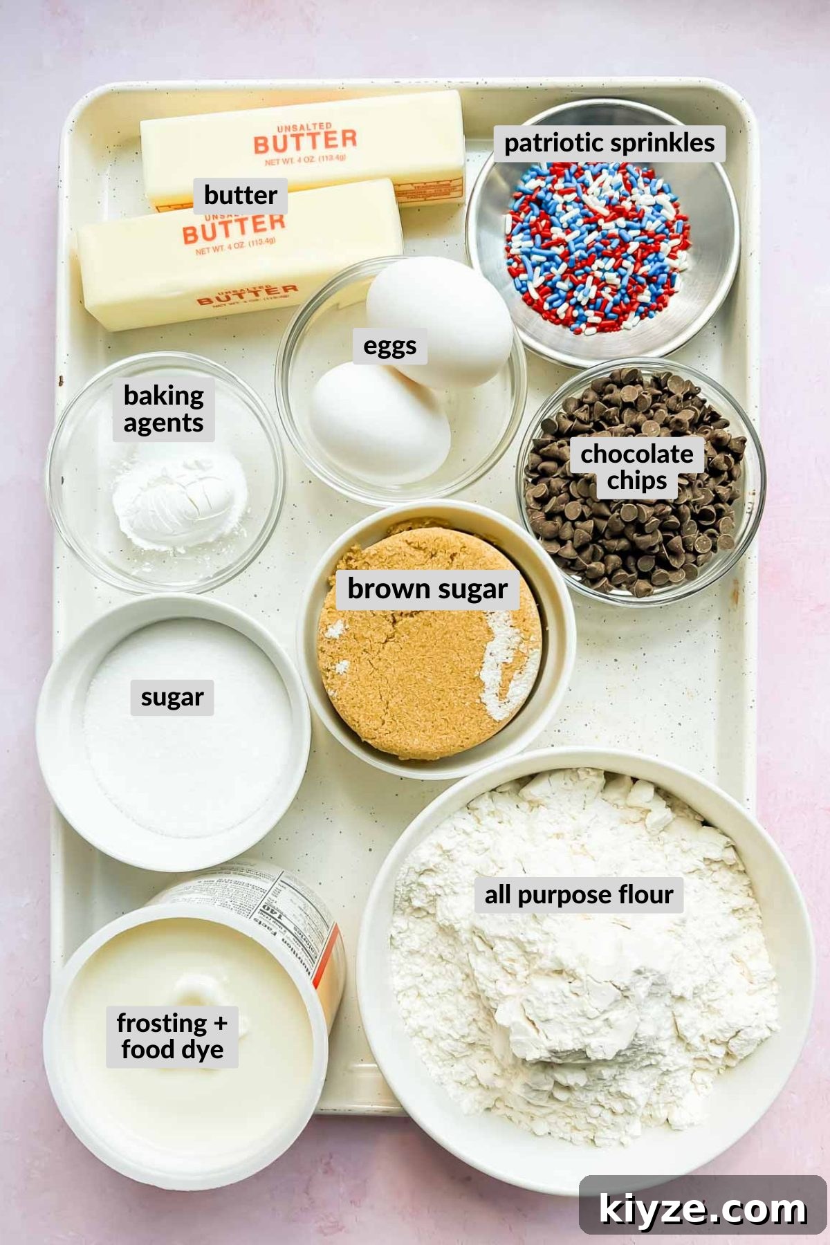 Fourth of July Flag Cookie Cake Recipe 3 ingredients for 4th of July Cookie Cake in individual bowls on white baking sheet.