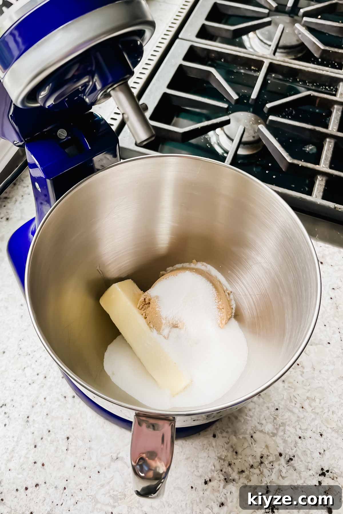 Fourth of July Flag Cookie Cake Recipe 4 raw cookie dough ingredients unmixed in stand mixer bowl.