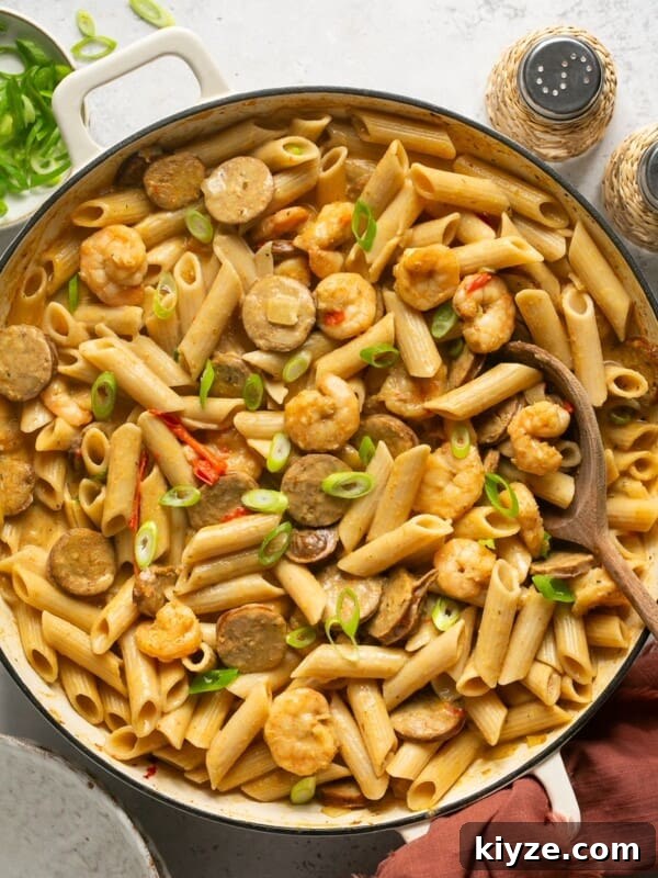 One-Pot Gluten-Free Chicken Parmesan Pasta Recipe 18 cajun shrimp and sausage pasta in a skillet topped with green onions