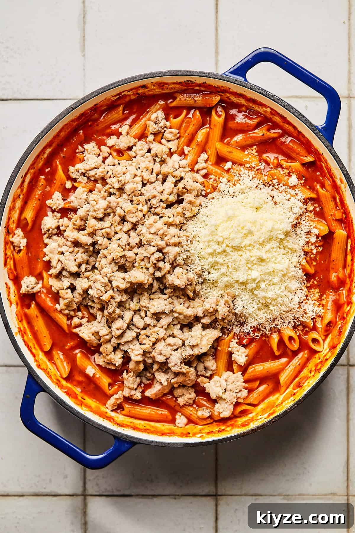 One-Pot Gluten-Free Chicken Parmesan Pasta Recipe 8 pasta with sauce and ground chicken and parmesan cheese