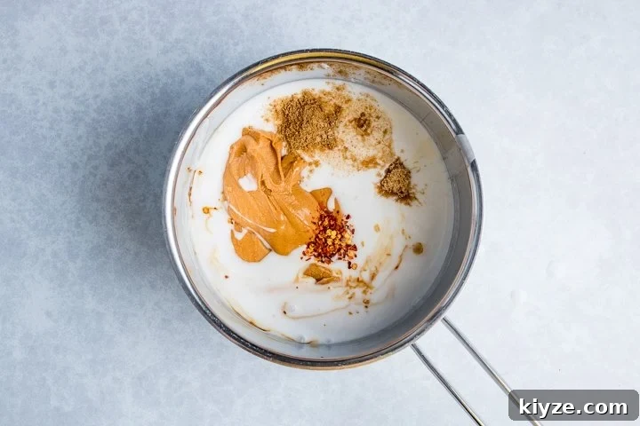 Homemade Satay Sauce Recipe for Grilled Chicken and Shrimp 4 Ingredients for Thai peanut sauce in a pan