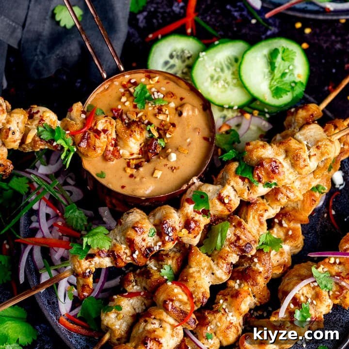Homemade Satay Sauce Recipe for Grilled Chicken and Shrimp 7 Square image of Chicken skewers with peanut satay sauce on a dark background