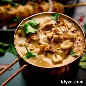 Homemade Satay Sauce Recipe for Grilled Chicken and Shrimp 8 Satay sauce in a small copper pan topped with peanuts and coriander