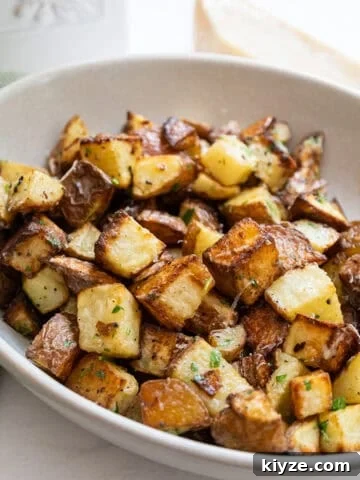 garlic parmesan potatoes in a bowl.