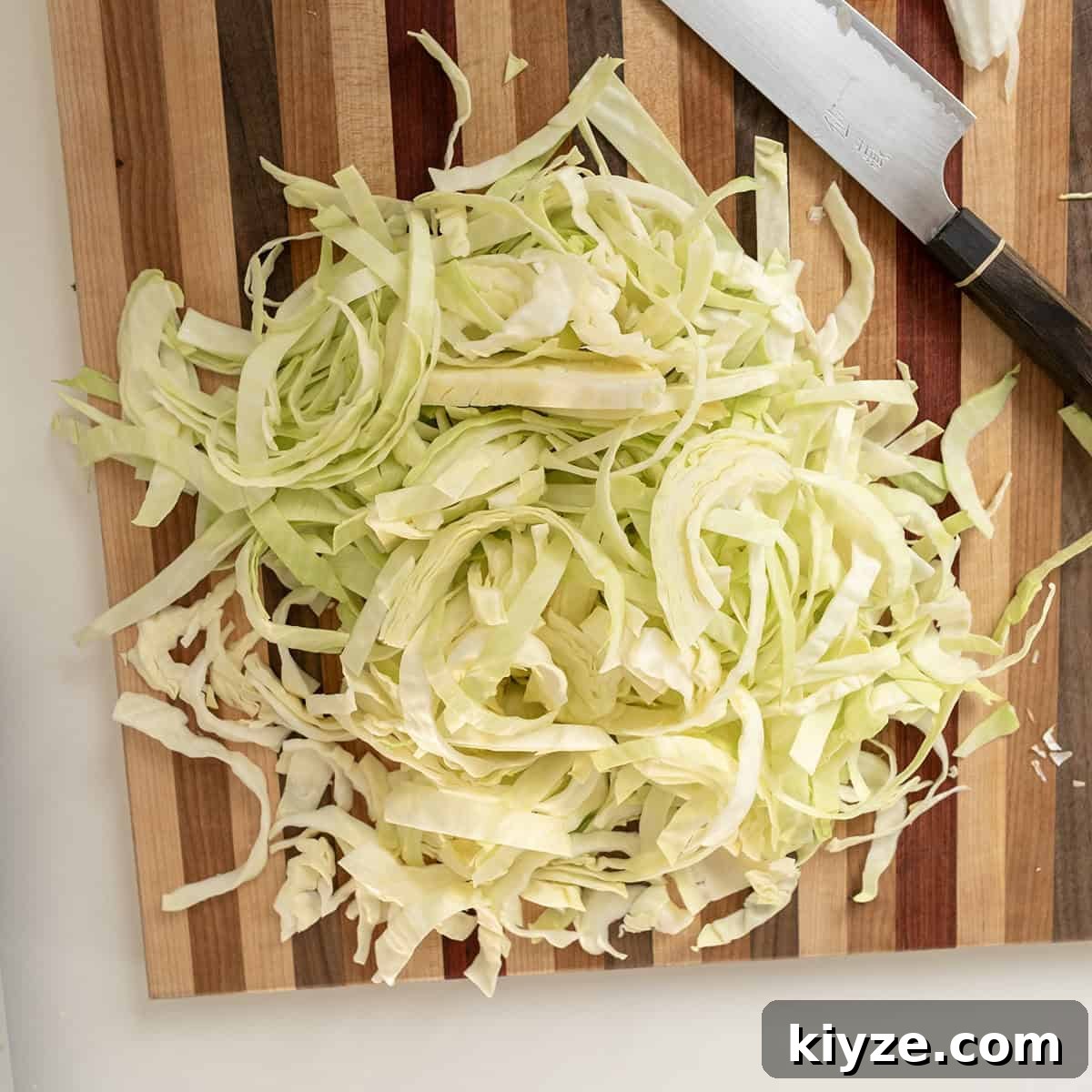 Savory Italian Cabbage with Garlic and Parmesan 4 Sliced cabbage on a cutting board.