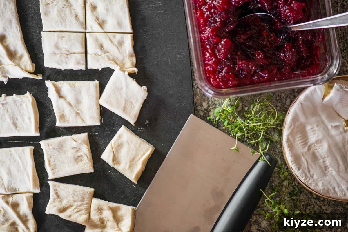 Cranberry and Brie Bites: Festive Holiday Appetizer Recipe 3 homemade cranberry sauce with brie and cresent roll dough