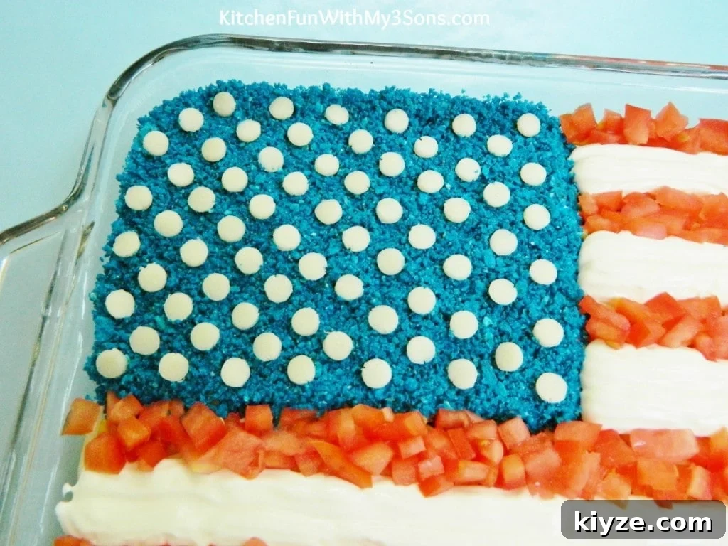 Patriotic 7-Layer Flag Dip Recipe for 4th of July Parties 5 7 Layer flag blue corn chips and cheese stars