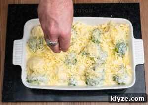 Cheesy Cauliflower and Broccoli Casserole Recipe 14 Sprinkling grated cheese over the Cauliflower and Broccoli Cheese