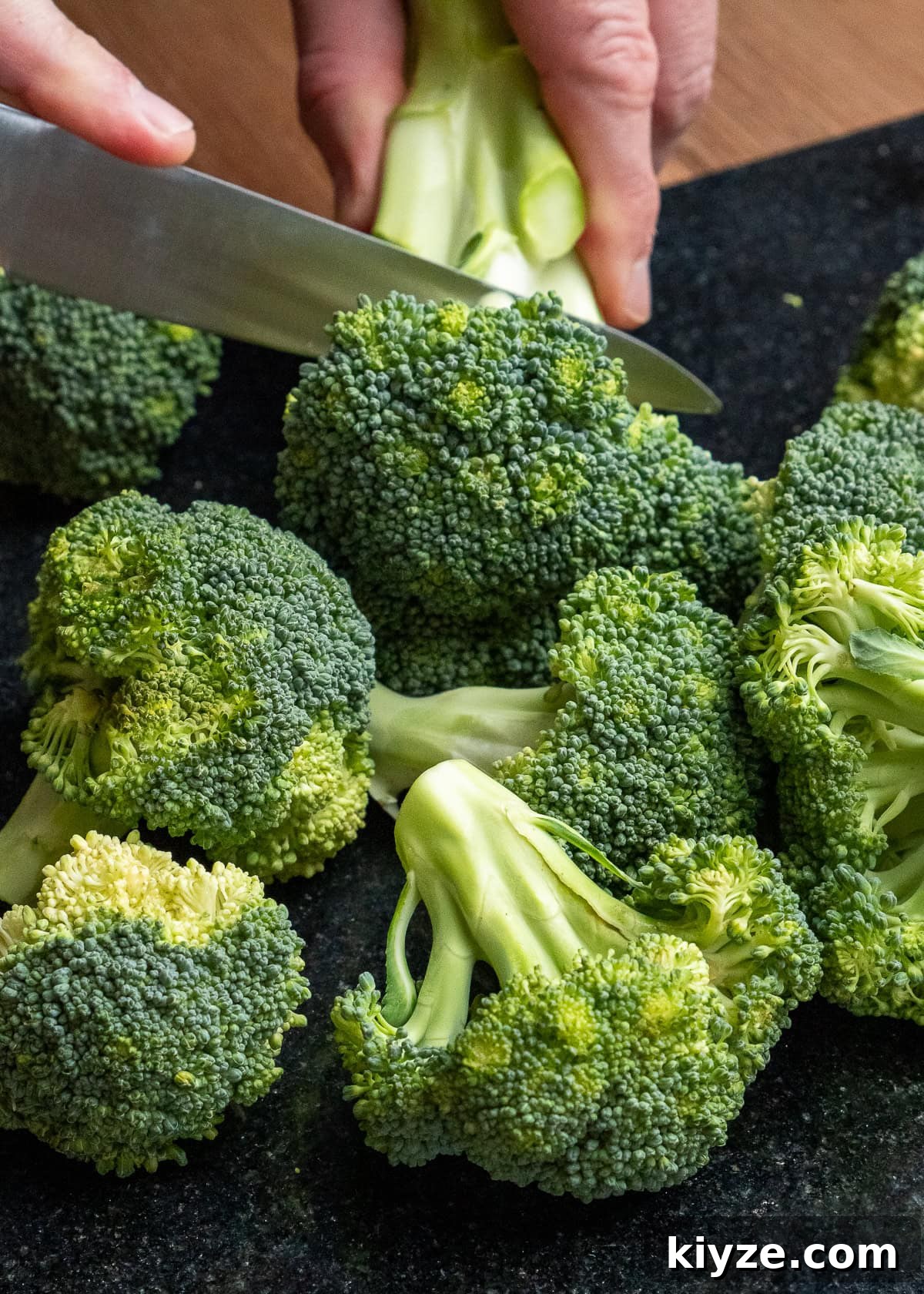 Cheesy Cauliflower and Broccoli Casserole Recipe 18 Cutting broccoli into florets using a sharp knife