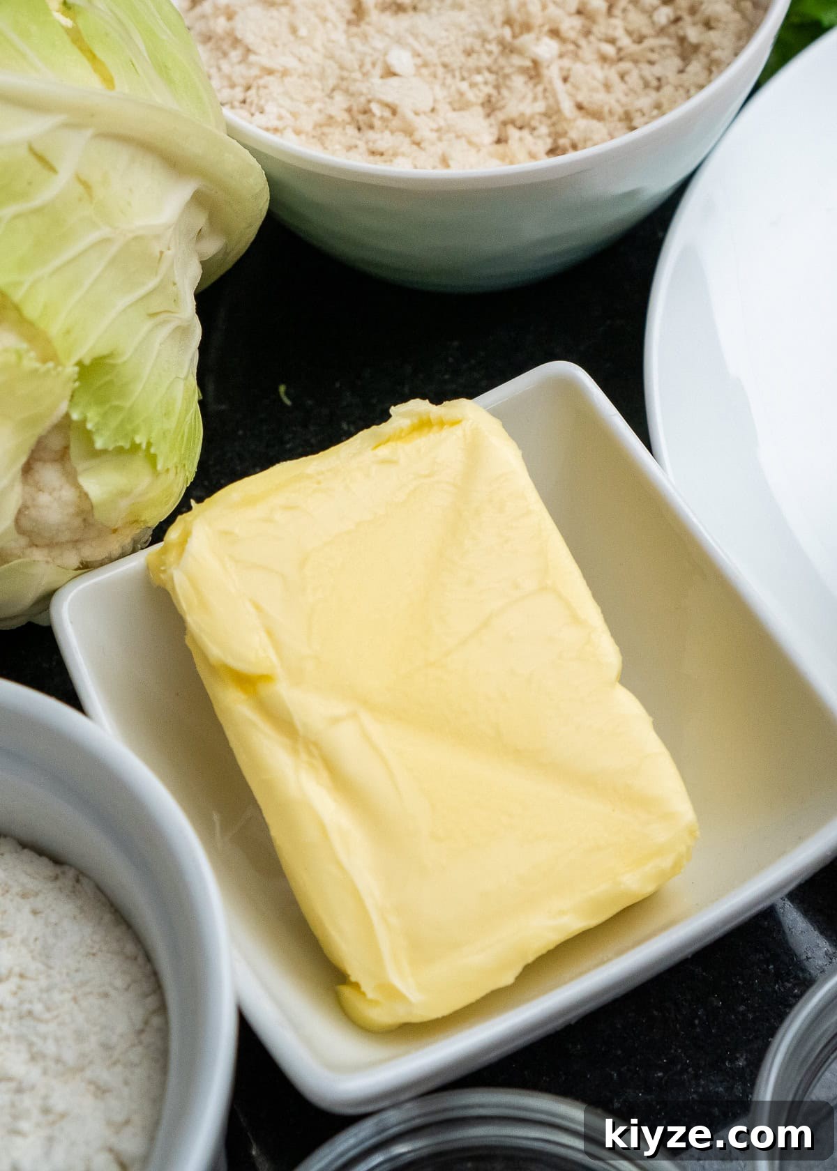 Cheesy Cauliflower and Broccoli Casserole Recipe 20 50g of butter in a small white dish