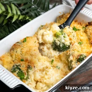 Cheesy Cauliflower and Broccoli Casserole Recipe 4 Cauliflower and Broccoli Cheese being picked up with a spoon