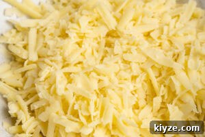 Cheesy Cauliflower and Broccoli Casserole Recipe 5 A bowl of mature cheddar cheese grated