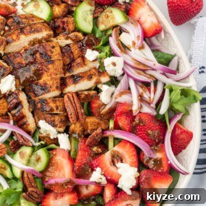 Grilled Chicken and Strawberry Salad with Balsamic Glaze 9 A serving platter with strawberry goat cheese salad and grilled chicken with balsamic dressing.