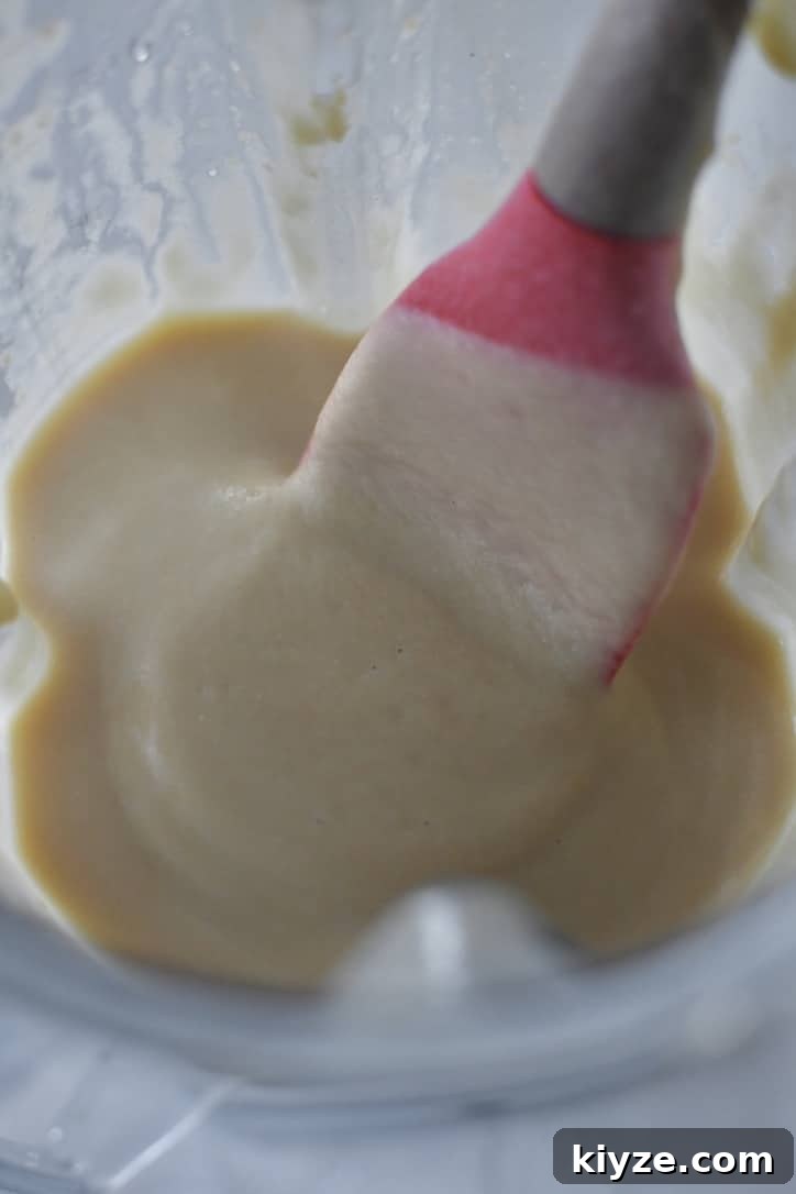 Creamy Homemade Hummus: Simple Recipe with Tahini & Lemon 7 Chickpeas in a high speed blender that have been pureed to a smooth paste.