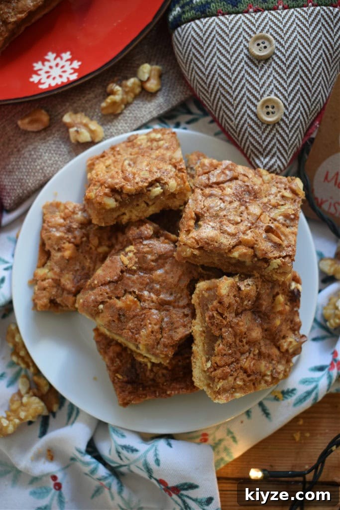 Chewy Maple Walnut Bars with Brown Butter Glaze 2 Maple Walnut Bars on a plate