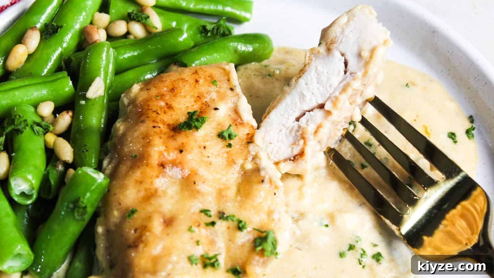 A plate with chicken and green beans on it.