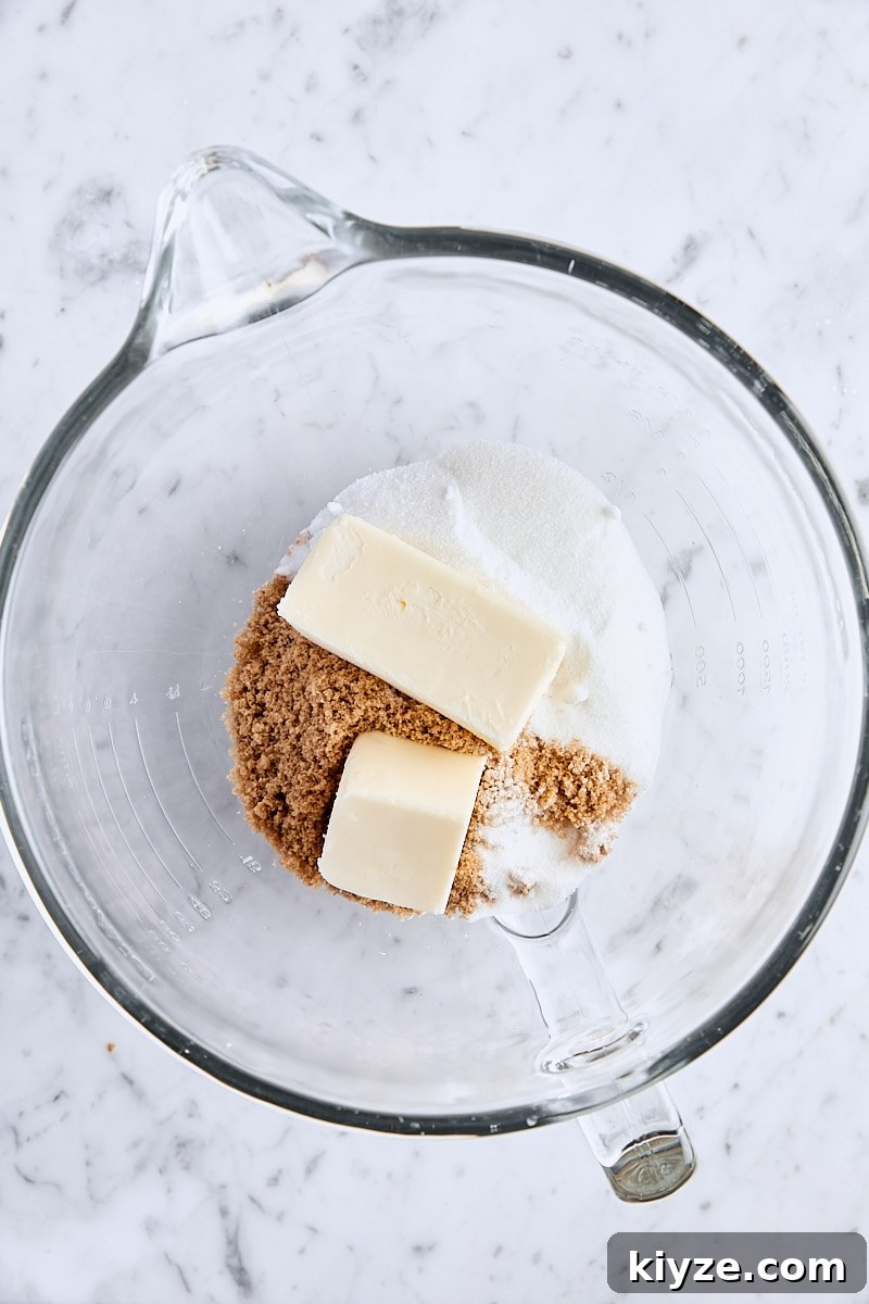 Spiced Bundt Cake with Gooey Butterscotch Topping 6 Unsalted butter, dark brown sugar, and granulated sugar in glass mixing bowl