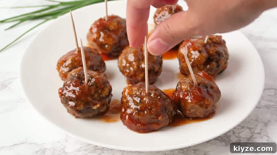 Sweet and Spicy Apricot Glaze for Meatballs and Dipping Sauce 3 sweet & spicy apricot glaze being served as a sweet & spicy meatball appetizer with toothpicks