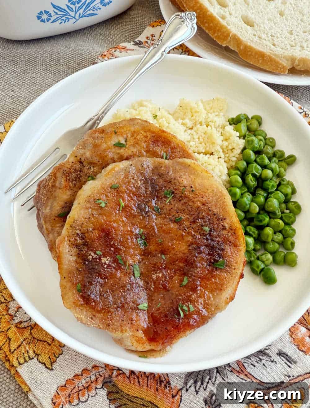 Brown Sugar Baked Pork Chops with Caramelized Glaze 8 baked pork chops with brown sugar and paprika on plate.